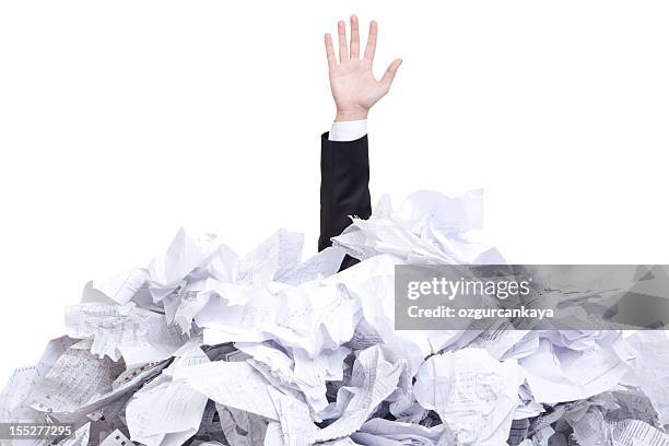 a man covered with tones of torn paper - stack of paper stock pictures, royalty-free photos & images
