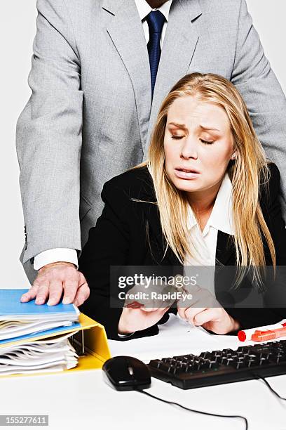 miserable young businesswoman shrinks from man harassing her - rea001 stock pictures, royalty-free photos & images