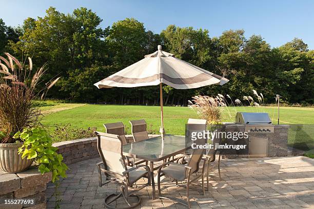 backyard barbeque with table and grill. - garden furniture stockfoto's en -beelden