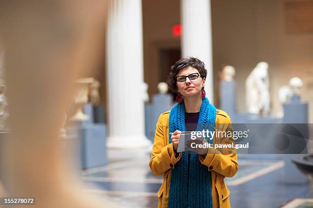 young woman in museum - art fair stockfoto's en -beelden