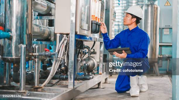 maintenance engineer working in the water factory - water pumping station stock pictures, royalty-free photos & images