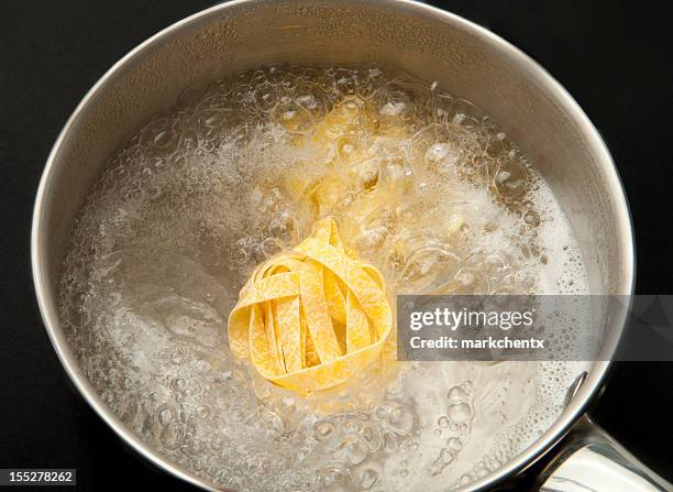 cooking tagliatelle - boiling water stock pictures, royalty-free photos & images