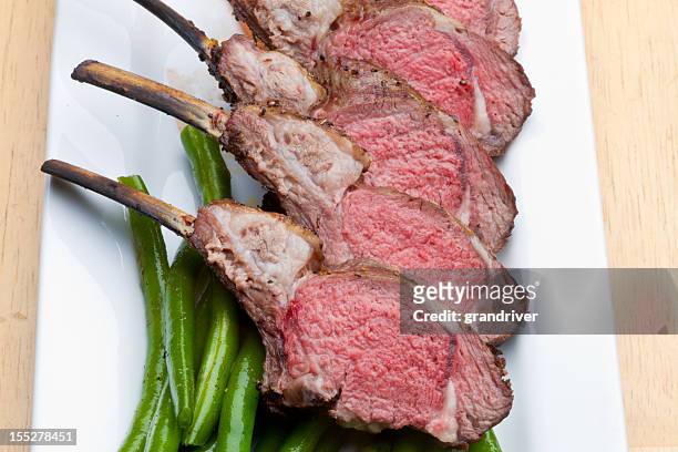 rack of lamb with carrots and green beans - easter lamb stock pictures, royalty-free photos & images