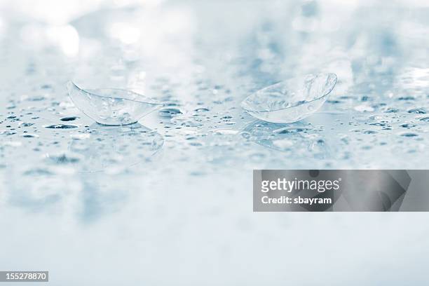 contact lens with water dorps - contact lens stock pictures, royalty-free photos & images