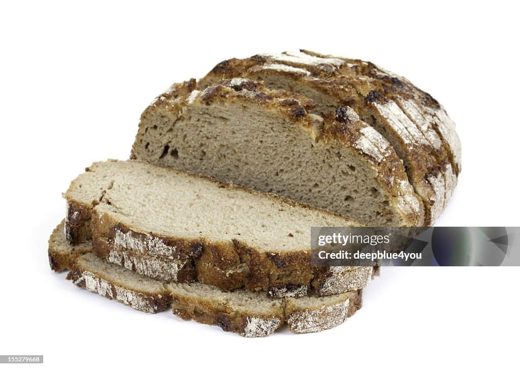 Sliced crusty whole grain bread isolated on white