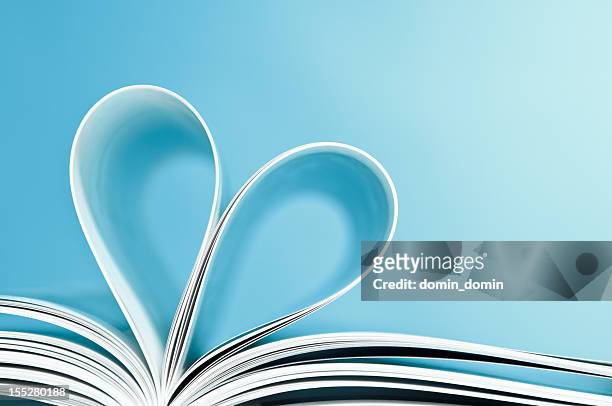love to reading books, pages folded into a heart shape - book blue bildbanksfoton och bilder