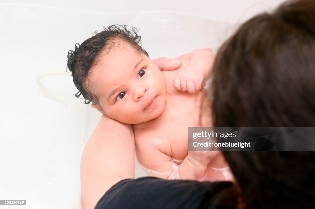 Mother Is Bathing Her Newborn Baby (1 month old)