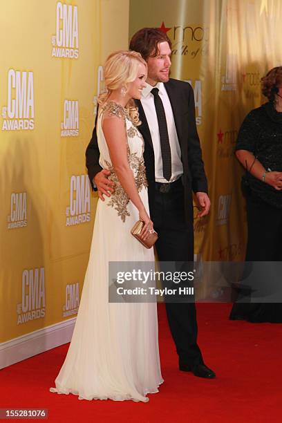 Singer Carrie Underwood and Nashville Predators Centre Mike Fisher attend the 46th annual CMA Awards at the Bridgestone Arena on November 1, 2012 in...