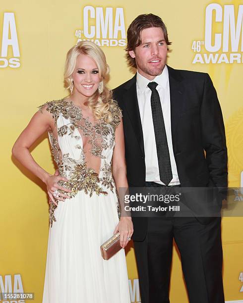 Singer Carrie Underwood and Nashville Predators Centre Mike Fisher attend the 46th annual CMA Awards at the Bridgestone Arena on November 1, 2012 in...