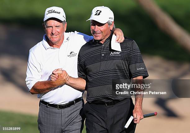 Jay Haas and Fred Couples shake hands on the 18th green following their second round finish of the Charles Schwab Cup Championship on the Cochise...