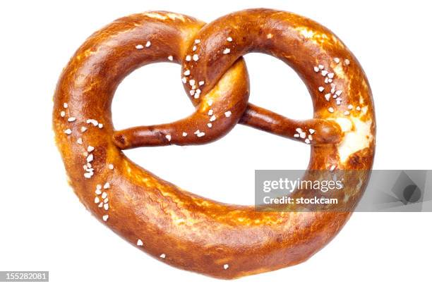 german bread pretzel on a white background - pretzel twist stock pictures, royalty-free photos & images