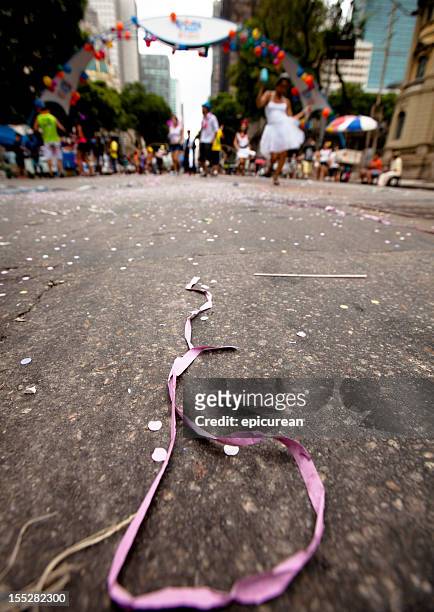 ribbons and confetti in the wake of a bloque - rio de janeiro street stock pictures, royalty-free photos & images