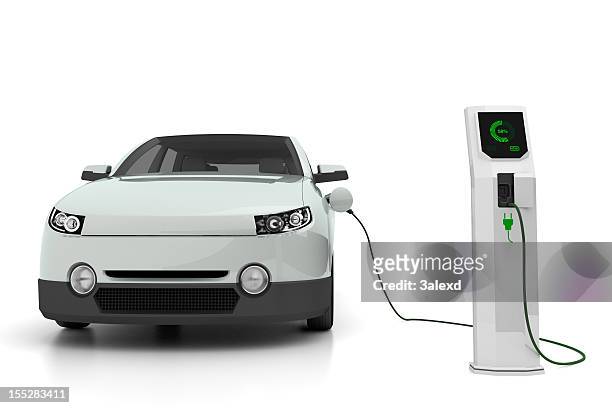 electric car plugged into the charging station - electric vehicle charging station stock pictures, royalty-free photos & images