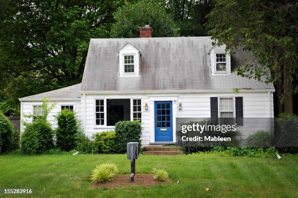 white colored house with blue door - white house blue shutters stock pictures, royalty-free photos & images