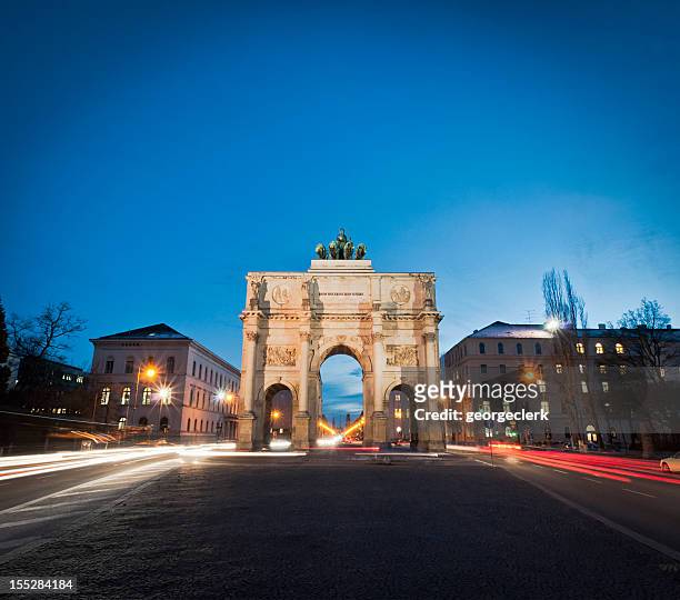 victory gate in munich - munich night stock pictures, royalty-free photos & images