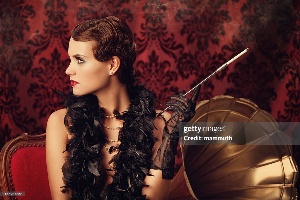 Retro woman listening to music and smoking cigarette