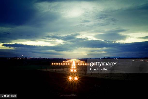 view on navigation lights at dusk - airfield stock pictures, royalty-free photos & images