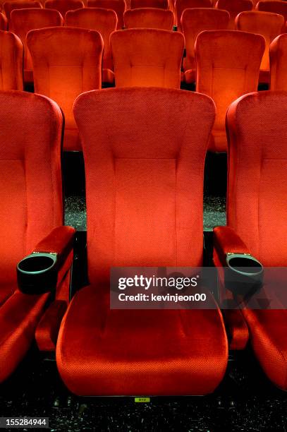 red theatre seats - attending play stock pictures, royalty-free photos & images