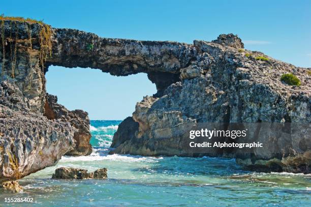 hell's gate, antigua as seen from the shore - antiga stock pictures, royalty-free photos & images