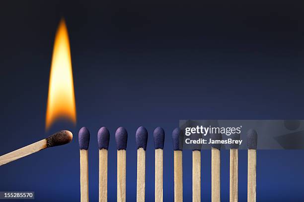 one lit match; share your passion, ignite it in others - match flame stock pictures, royalty-free photos & images