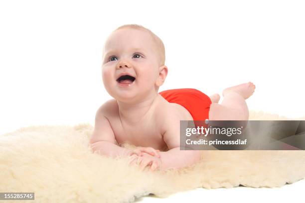 baby on a sheepskin - reusable diaper stock pictures, royalty-free photos & images