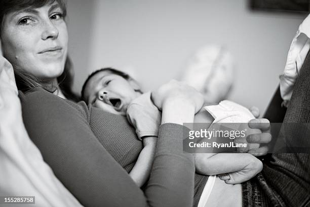 baby boy resting on mother - yawning mother child stock pictures, royalty-free photos & images