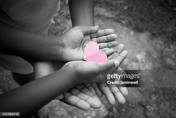 love sharing - child love heart hands stock pictures, royalty-free photos & images