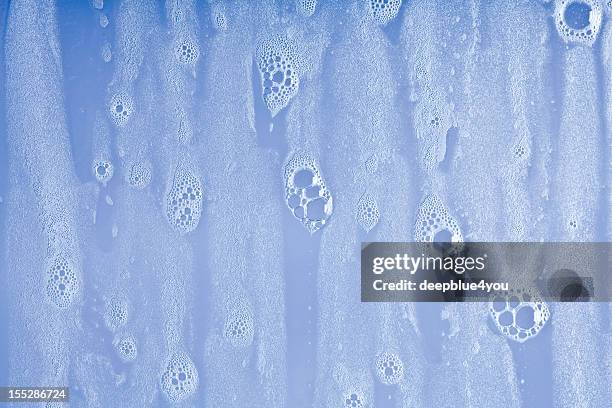 wet windows with soap bubbles background - bath bubble stockfoto's en -beelden