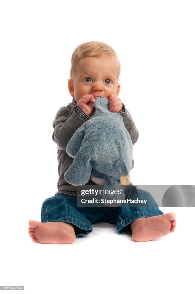 Cute Baby bitting his stuffed animal isolated on white