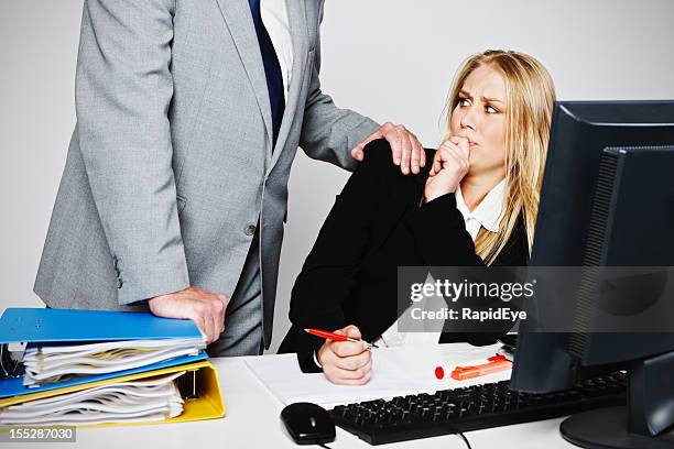 young businesswoman tries to avoid lecherous older man - rea001 stock pictures, royalty-free photos & images