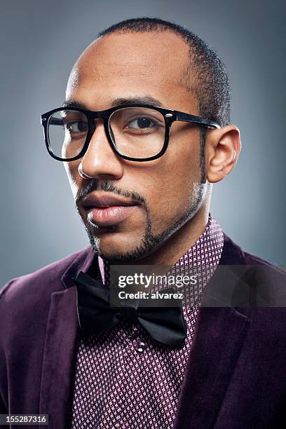 young man with a  bow tie - goatee stockfoto's en -beelden