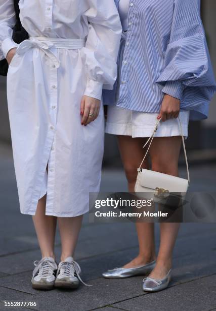 Tabea Heidenreich wearing white long SoSue dress, white Adidas Samba sneaker, black Vee collective bag and Marlene Fey wearing light blue SoSue...