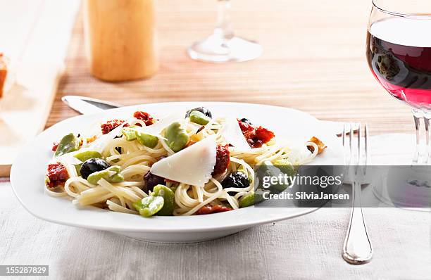 vegetarian pasta fava beans olives pecorino - fava bean stock pictures, royalty-free photos & images
