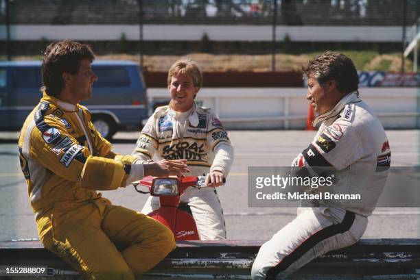 Italian-American racing driver Mario Andretti with his son, Michael , and nephew, John, August 21, 1988 at the CART PPG IndyCar World Series Quaker...
