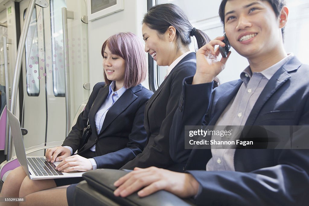 Businessmen working in Subway