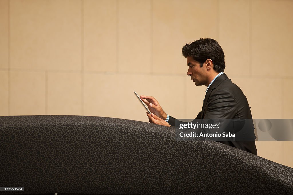 Businessman using tablet computer