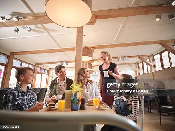 waitress serving family meal in farm shop cafe - waiter stock pictures, royalty-free photos & images