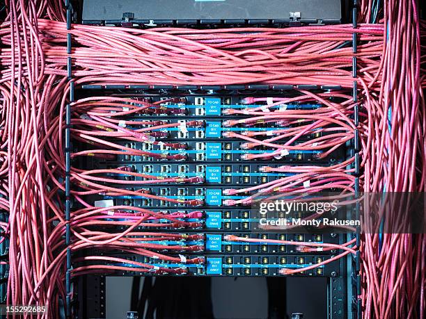 close up of cables and connectors in computer server room - computer server stock pictures, royalty-free photos & images