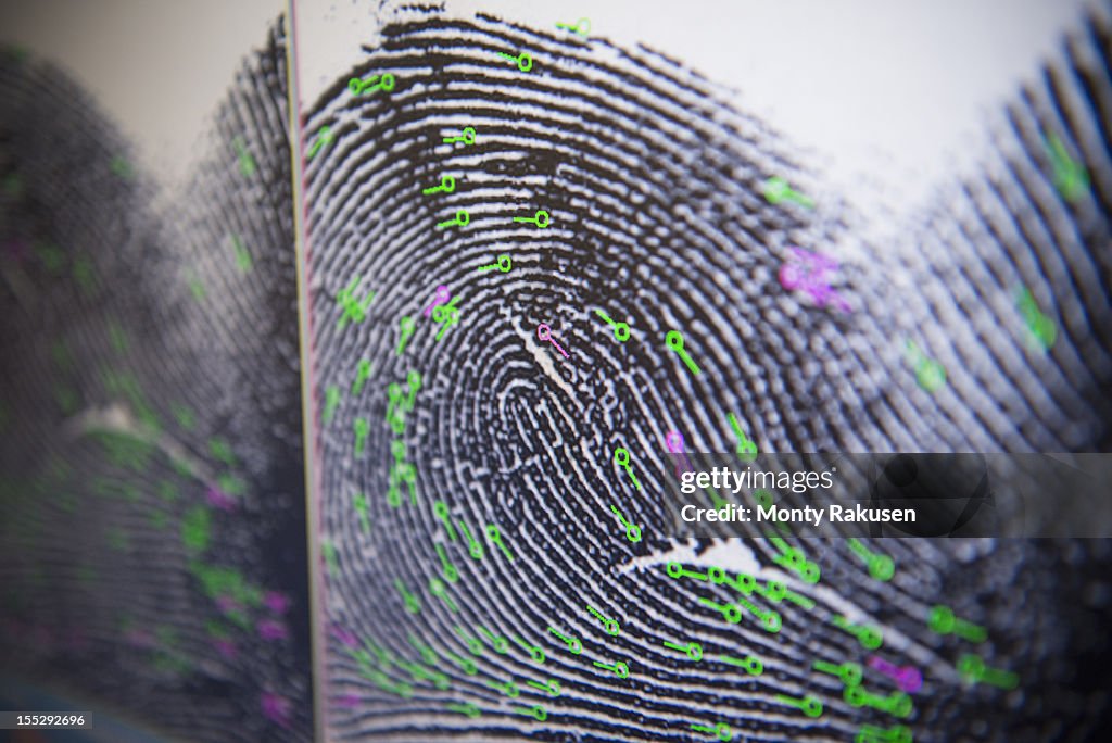 Close up detail of fingerprint on screen in forensic laboratory