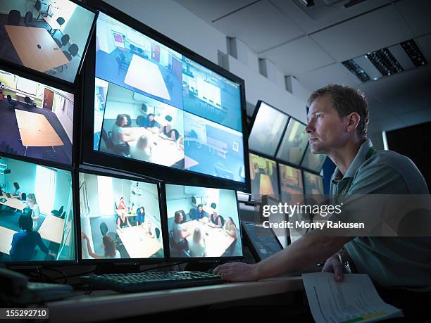 student looking at screens in forensics training facility - övervakningskamera bildbanksfoton och bilder