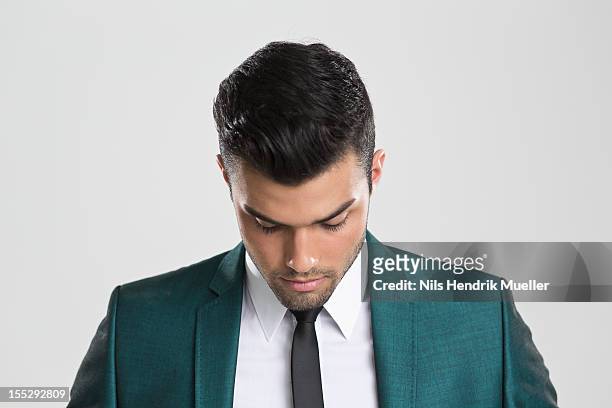 close up of businessman looking down - look down stock pictures, royalty-free photos & images
