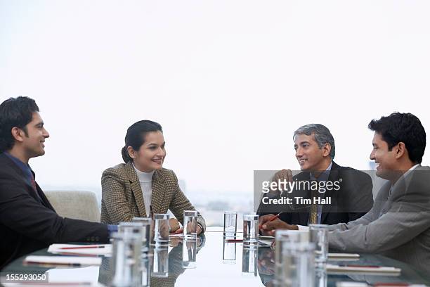 business people talking in meeting - インド系民族 ストックフォトと画像
