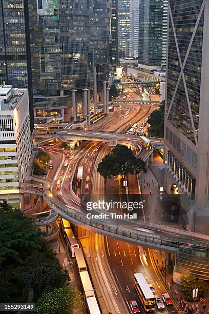 time lapse view of urban traffic - traffic time lapse stock pictures, royalty-free photos & images
