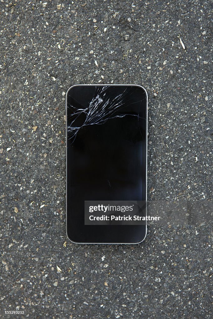 A smart phone with a cracked screen
