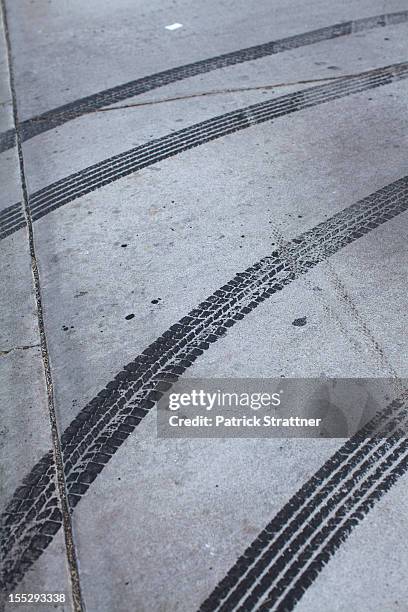 tire marks on concrete - skidding stock pictures, royalty-free photos & images