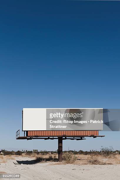 a blank billboard in a desert - us blank billboard stockfoto's en -beelden
