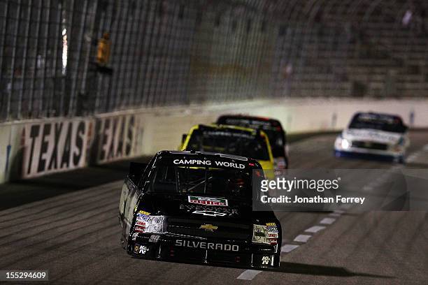 Nelson Piquet Jr., driver of the TAG Heuer Avant-Garde Eyewear Chevrolet, leads the field during the NASCAR Camping World Truck Series WinStar World...