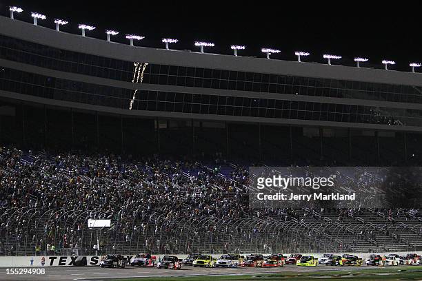 Nelson Piquet Jr., driver of the TAG Heuer Avant-Garde Eyewear Chevrolet, leads the field to the start of the NASCAR Camping World Truck Series...