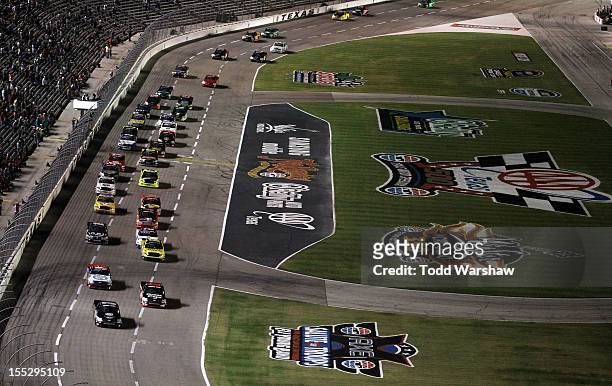 Nelson Piquet Jr., driver of the TAG Heuer Avant-Garde Eyewear Chevrolet, leads the field to the start of the NASCAR Camping World Truck Series...