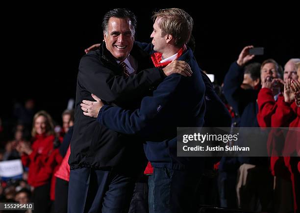 Republican presidential candidate, former Massachusetts Gov. Mitt Romney hugs his son Ben Romney during a campaign rally at The Square at Union...
